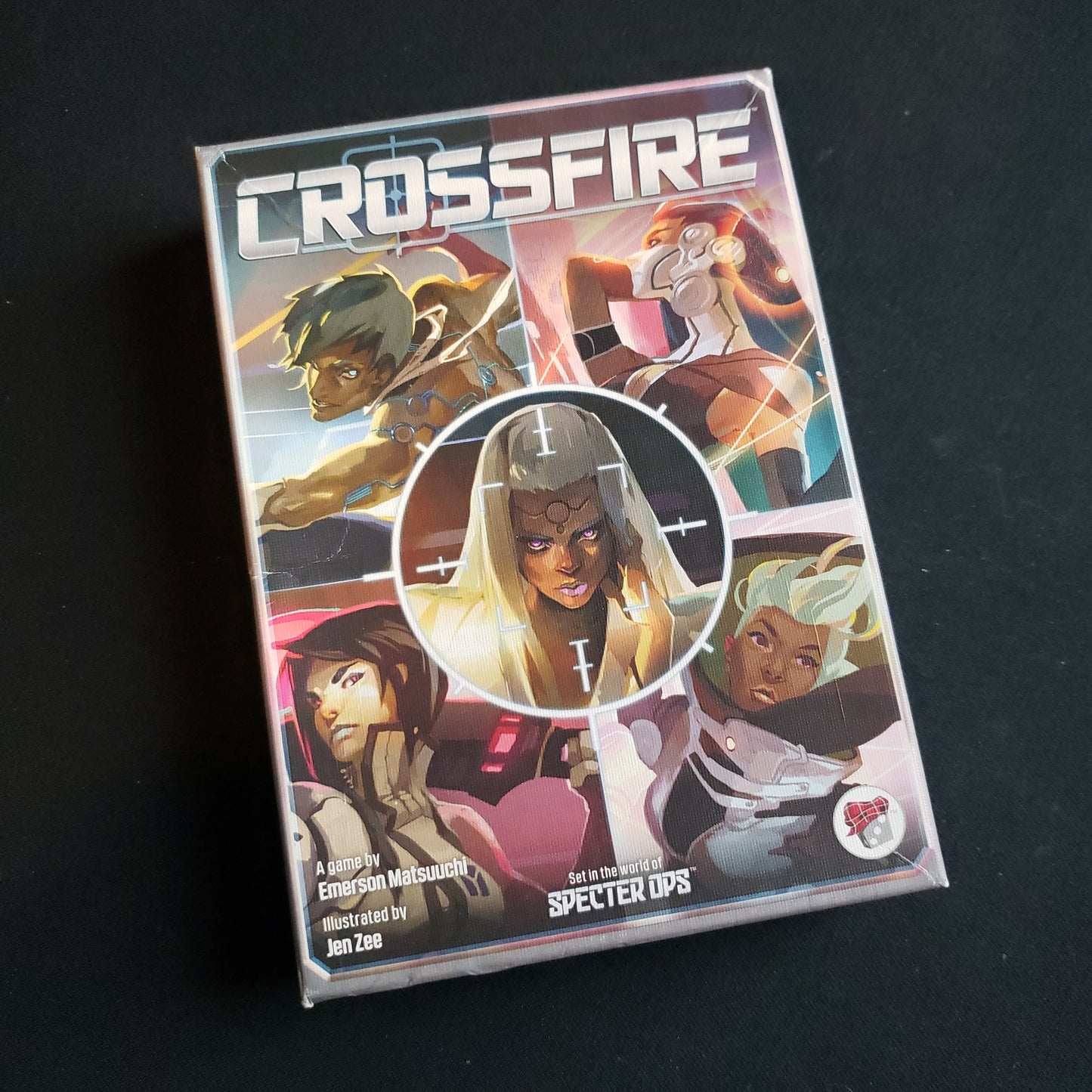 Image shows the front cover of the box of the Crossfire card game