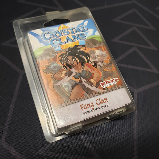 Image shows the front of the package of the Fang Clan expansion for the card game Crystal Clans