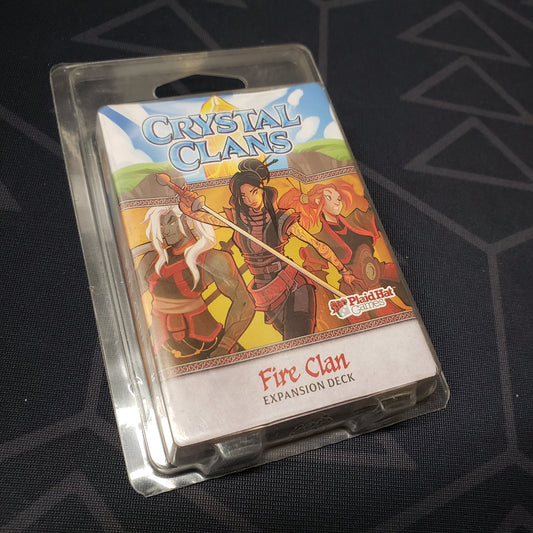 Image shows the front of the package of the Fire Clan expansion for the card game Crystal Clans