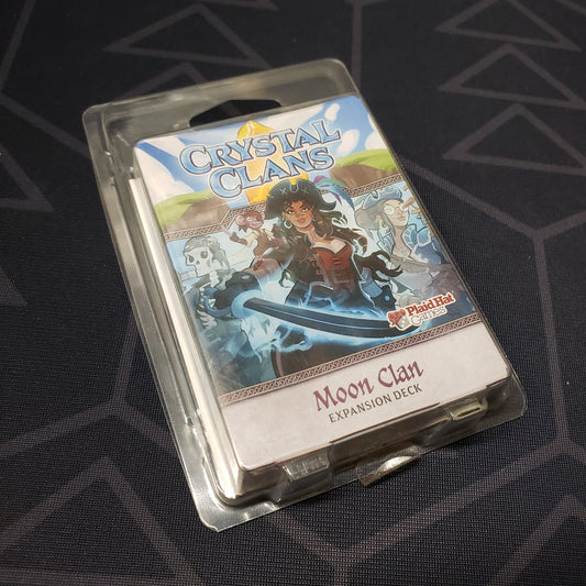 Image shows the front of the package of the Moon Clan expansion for the card game Crystal Clans