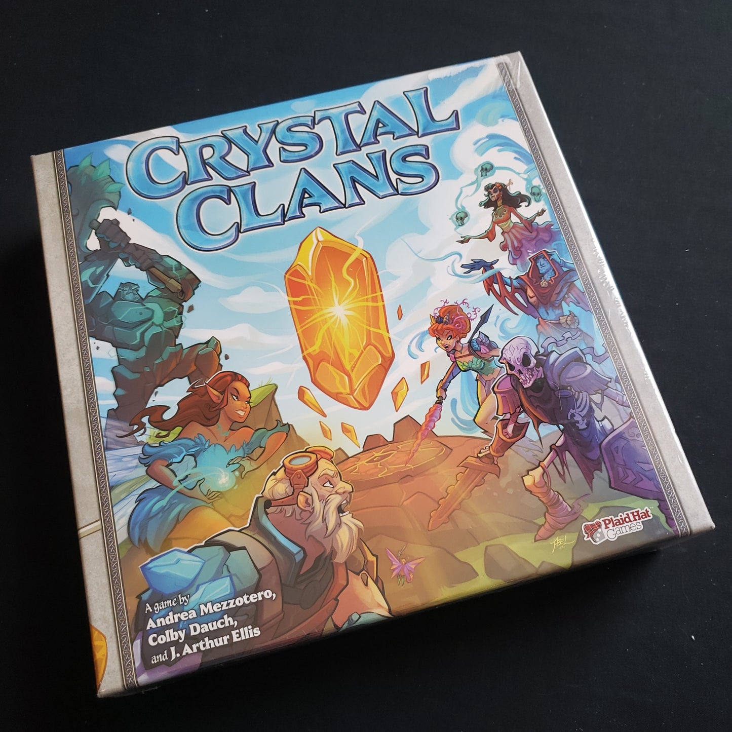 Image shows the front cover of the box of the Crystal Clans card game