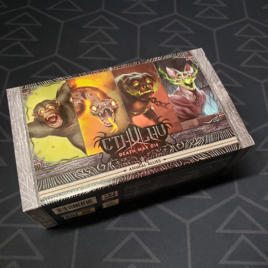 Image shows the front cover of the box of the Animal Allies expansion for the board game Cthulhu: Death May Die