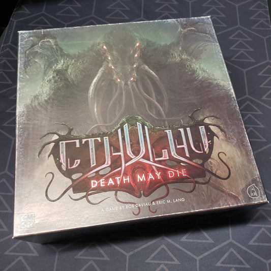 Image shows the front cover of the box of the Cthulhu: Death May Die board game