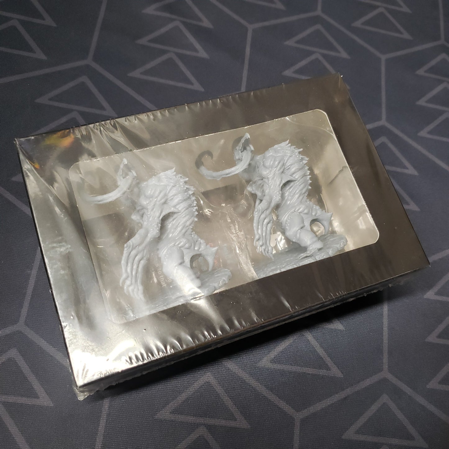 Image shows the front of the packaging for the Giant Blind Albino Penguins expansion for the board game Cthulhu Wars