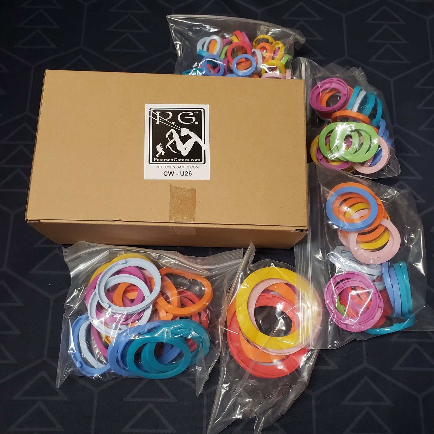 Image shows the cardboard box and bags of rings for the Neutral Unit Identifiers upgrade for the board game Cthulhu Wars