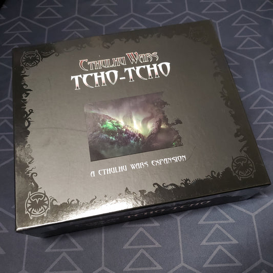 Image shows the front cover of the box of the Tcho-Tcho expansion for the board game Cthulhu Wars