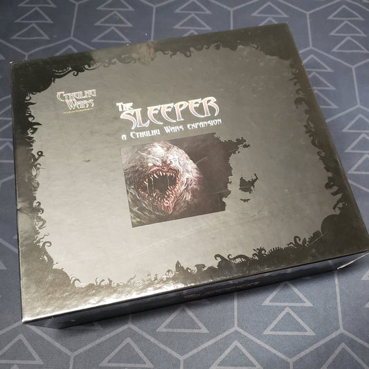 Image shows the front cover of the box of the Sleeper expansion for the board game Cthulhu Wars