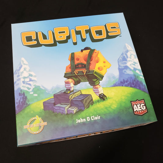 Image shows the front cover of the box of the Cubitos board game