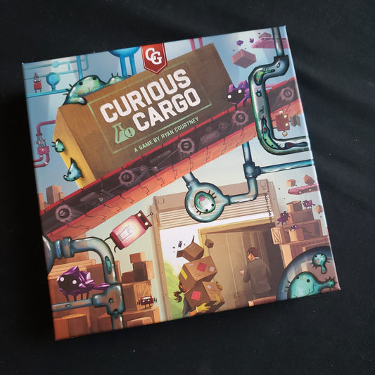 Image shows the front cover of the box of the Curious Cargo board game