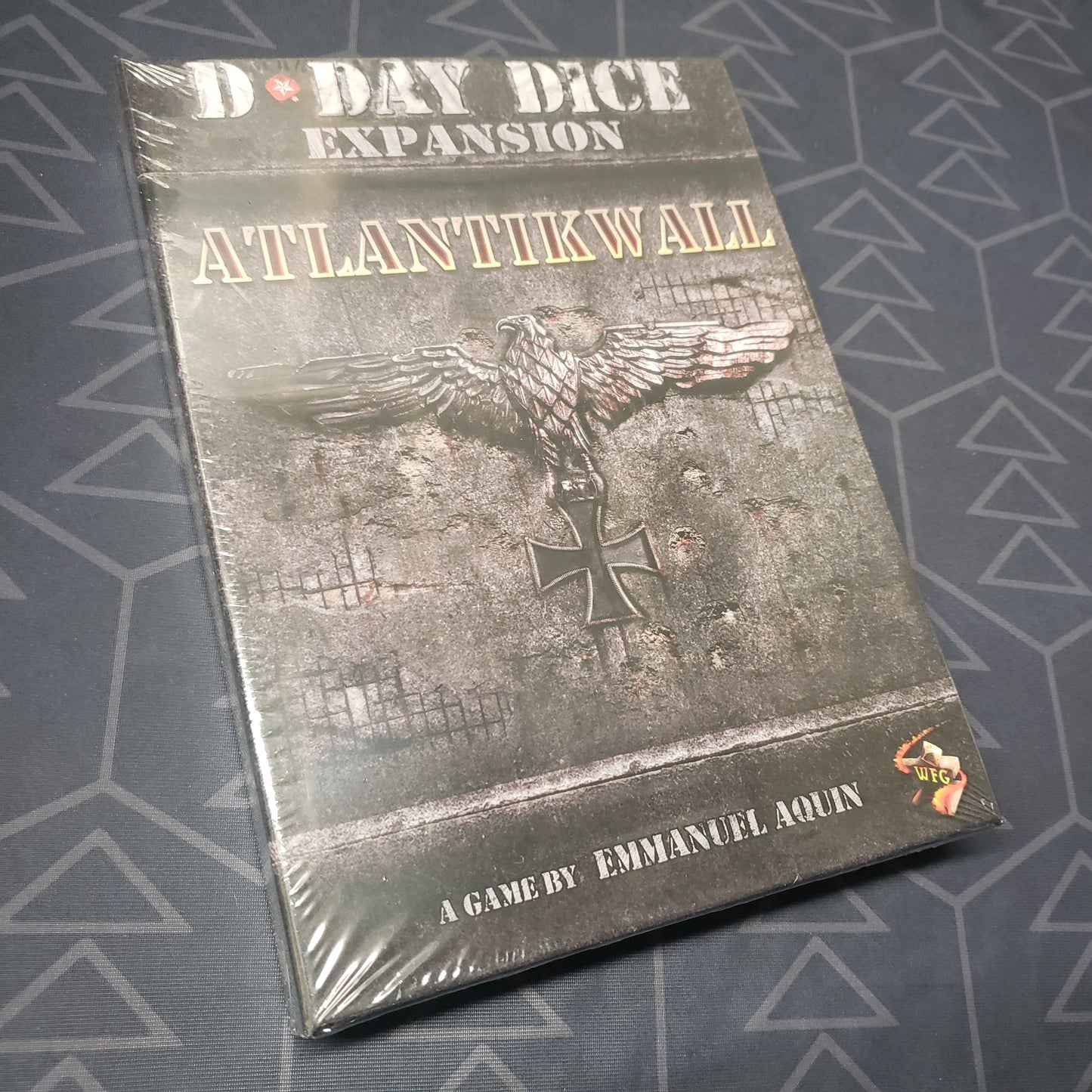 Image shows the front cover of the box of the Atlantikwall expansion for the board game D-Day Dice (Second Edition)