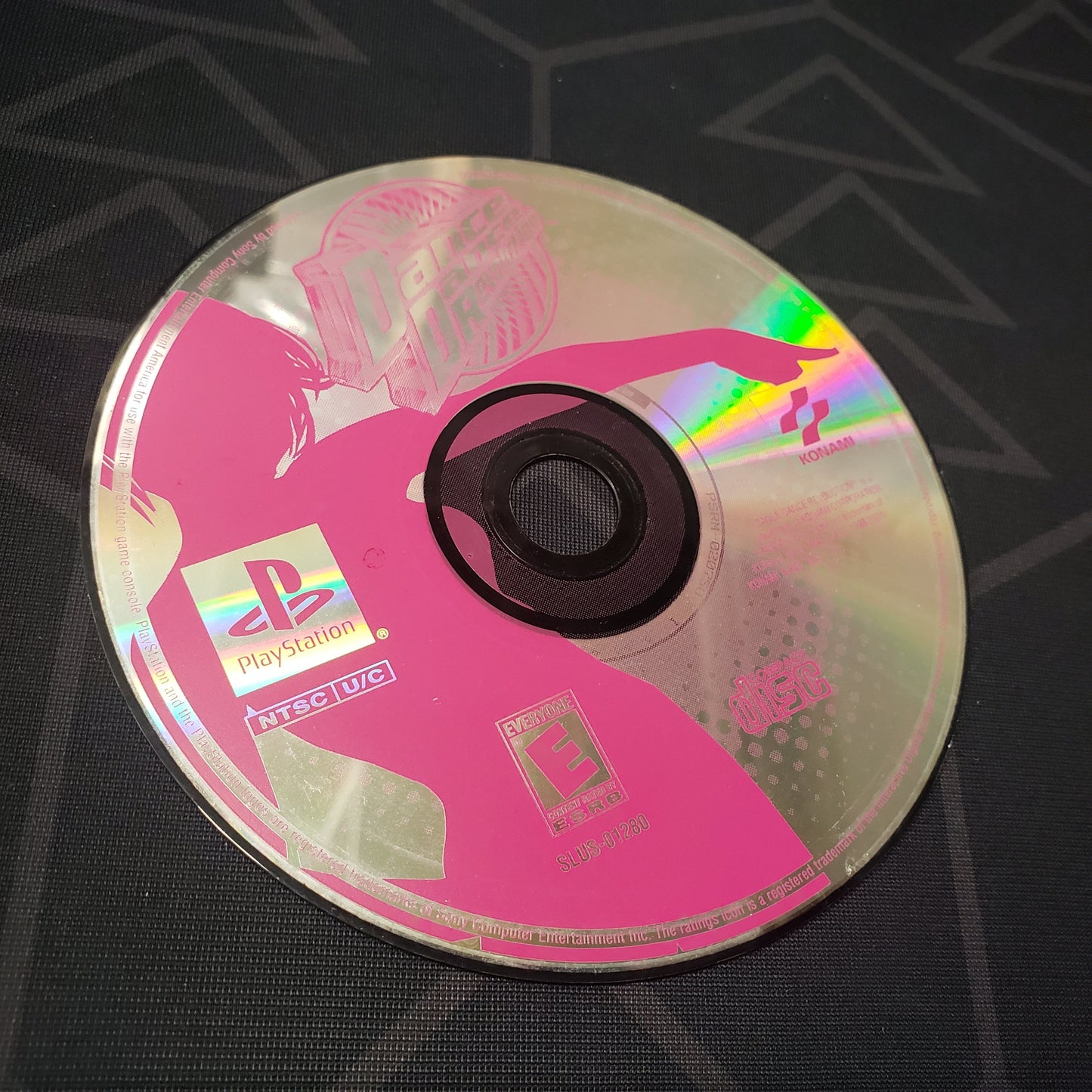 Image shows the label side of the game disc for the video game Dance Dance Revolution for Playstation 1