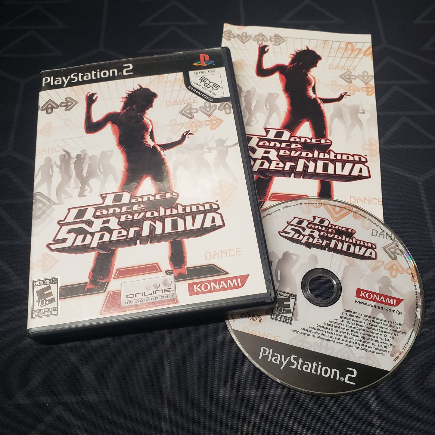 Image shows the case, manual and disc for the video game Dance Dance Revolution: SuperNOVA for Playstation 2