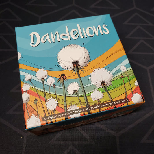 Image shows the front cover of the box for the Dandelions board game