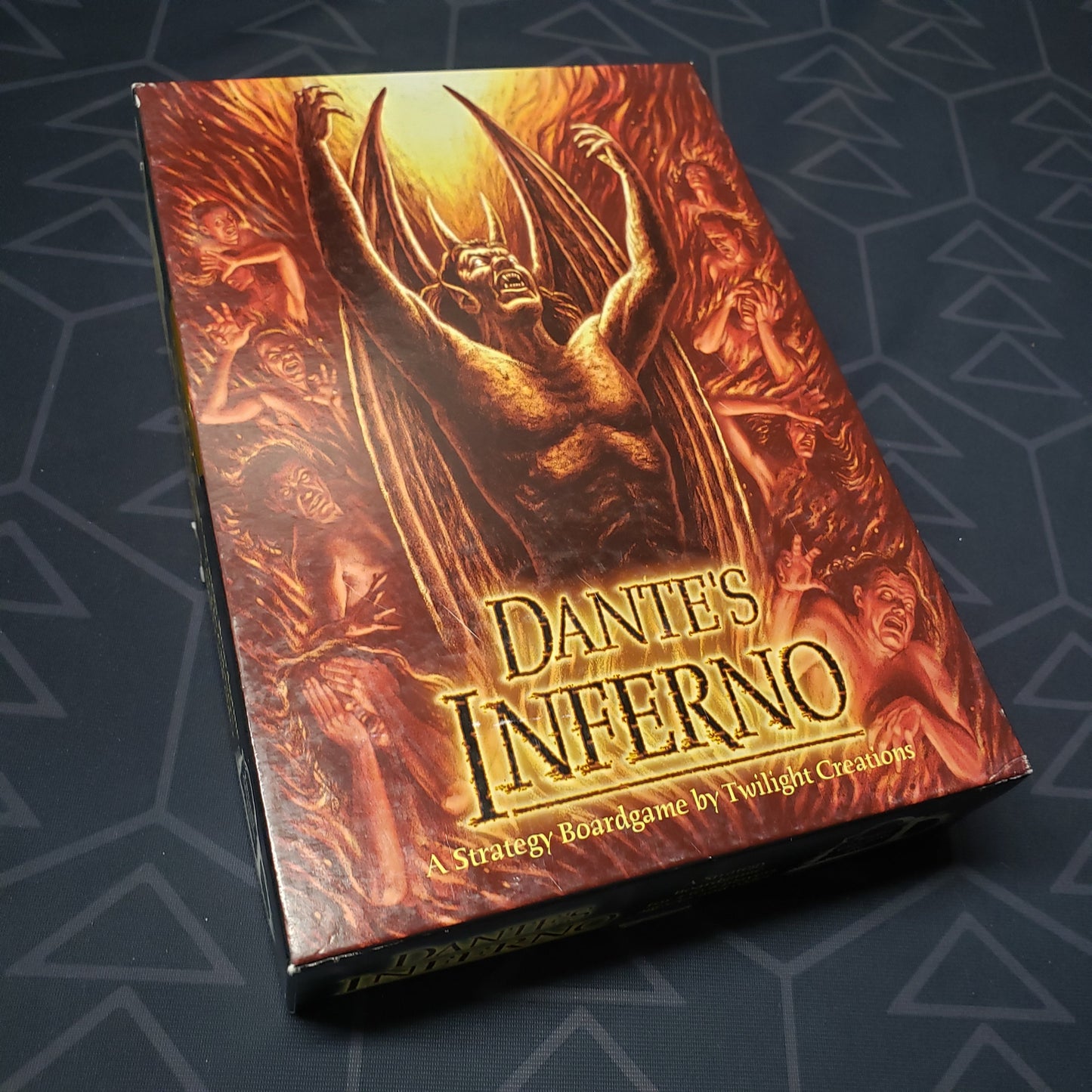 Image shows the front cover of the box for the Dante's Inferno board game
