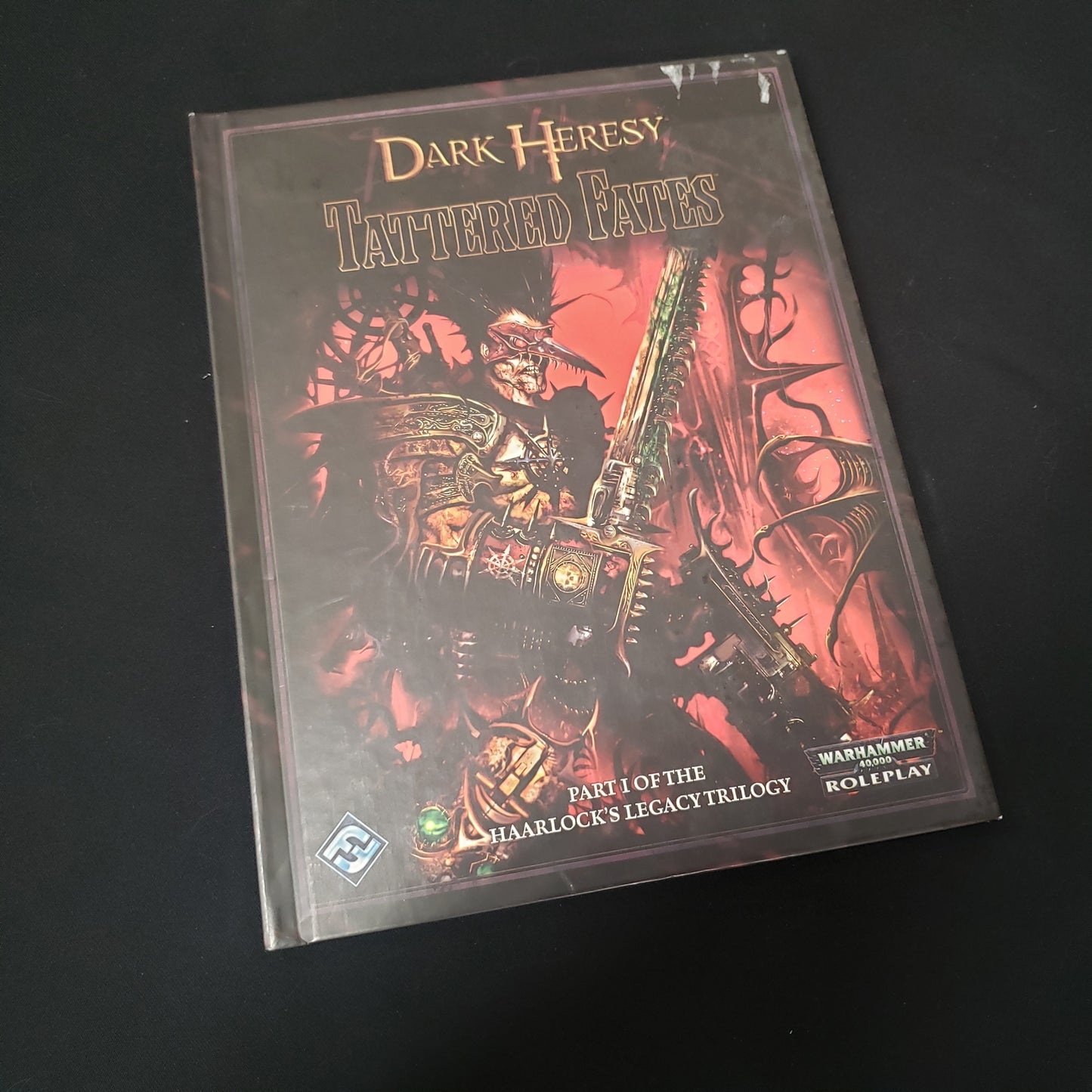 Image shows the front cover of the Tattered Fates book for the roleplaying game Dark Heresy