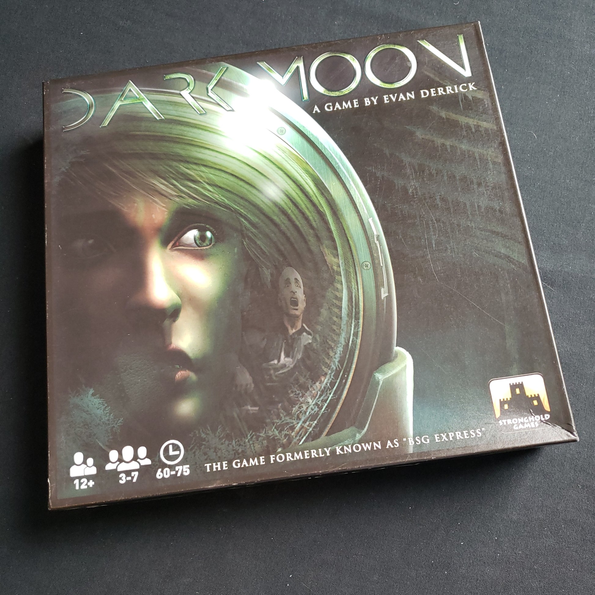 Image shows the front cover of the box of the Dark Moon board game