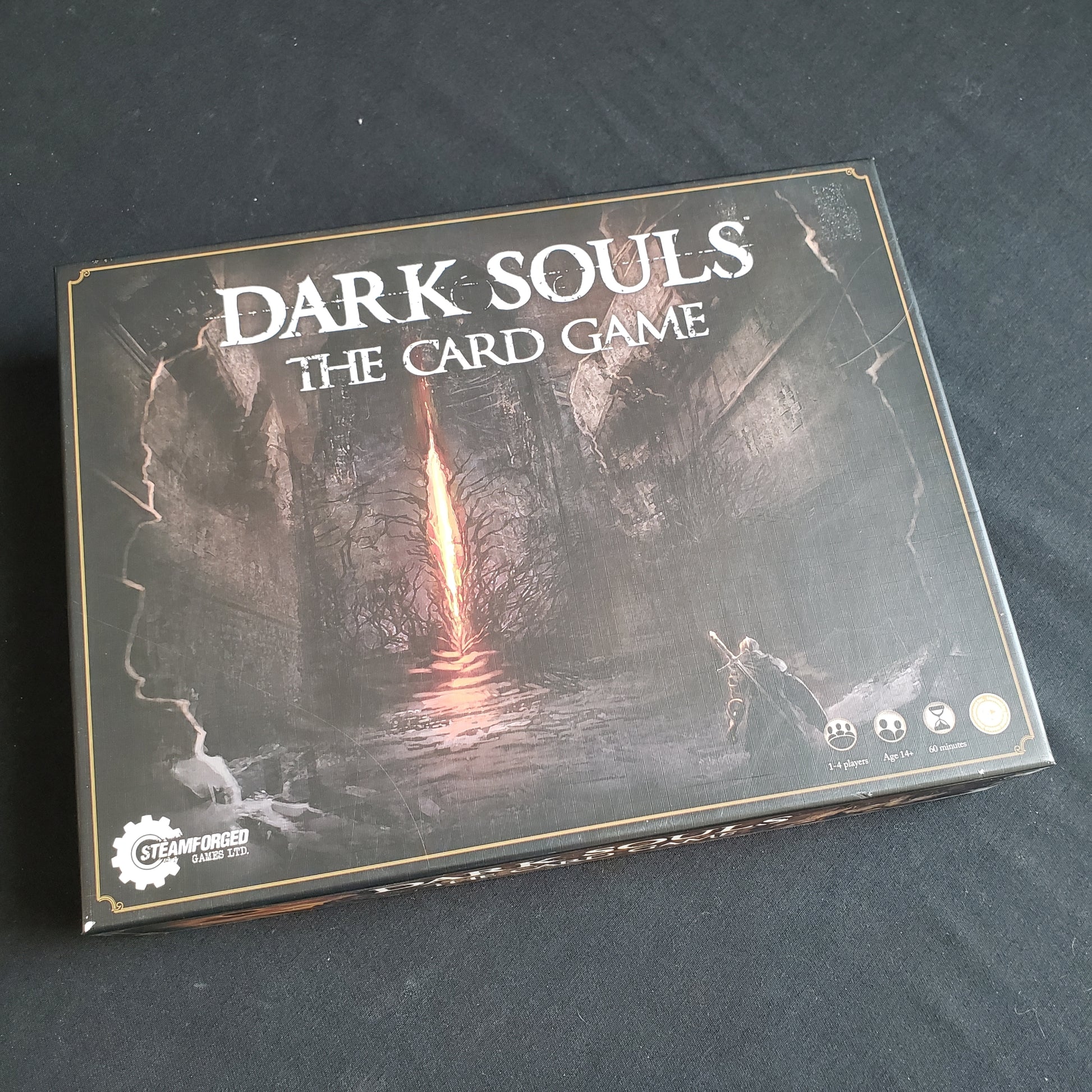 Image shows the front cover of the box of Dark Souls: The Card Game