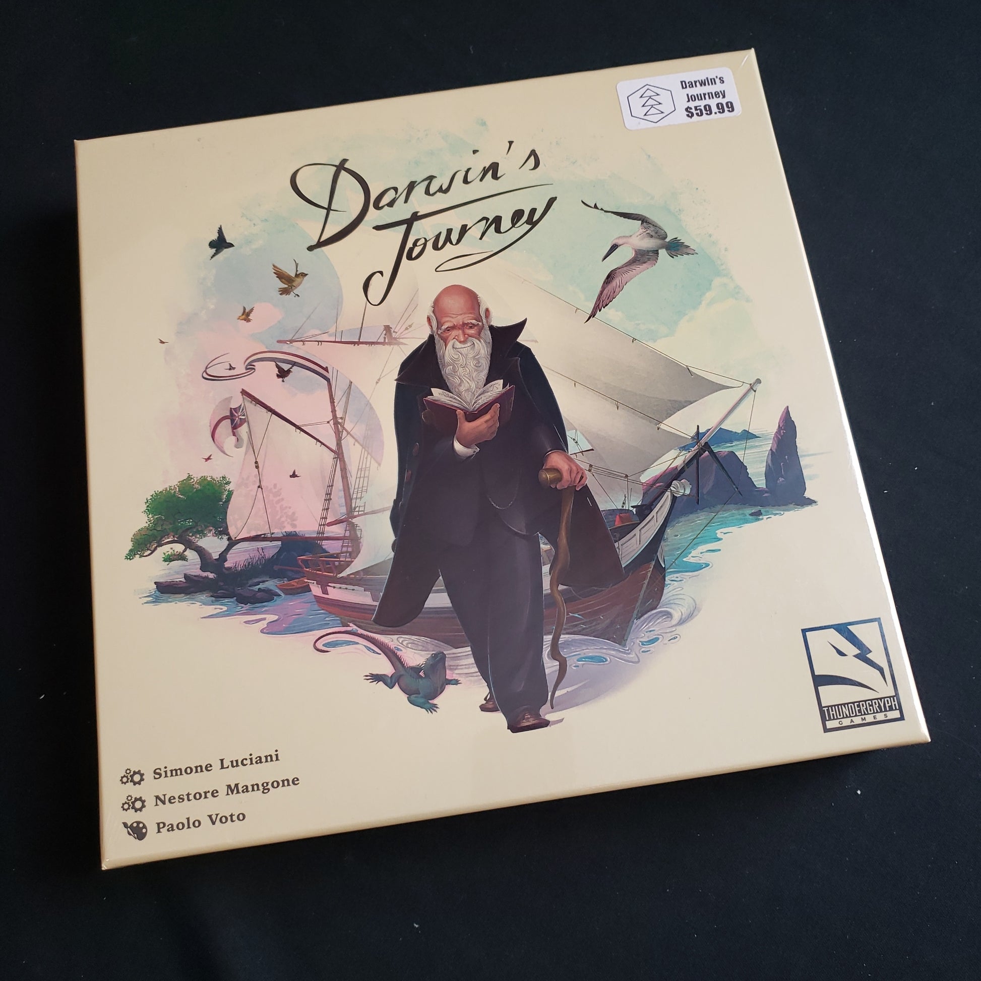 Image shows the front cover of the box of the Darwin's Journey board game