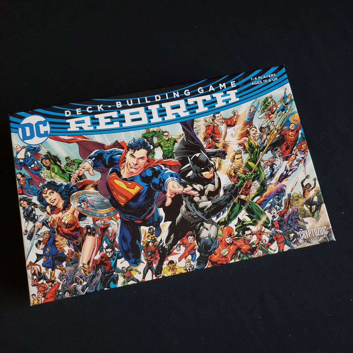 Image shows the front of the box for the Rebirth base game for the DC Comics Deckbuilding card game