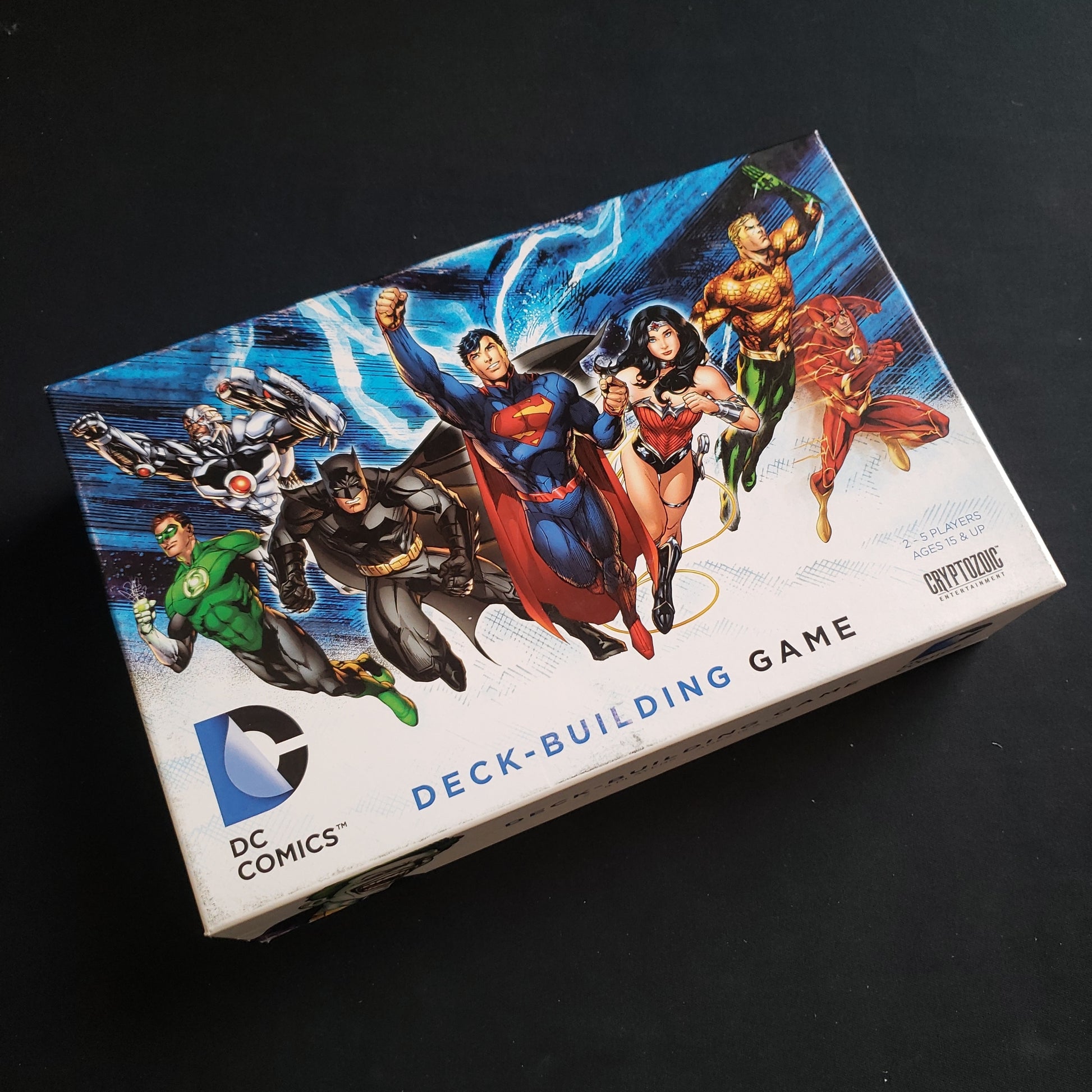 Image shows the front cover of the box of the DC Comics Deckbuilding card game