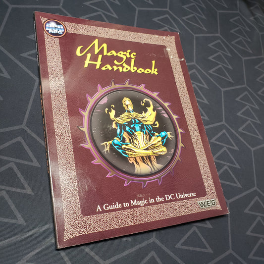 Image shows the front cover of the Magic Handbook book for the West End Games' roleplaying game DC Universe