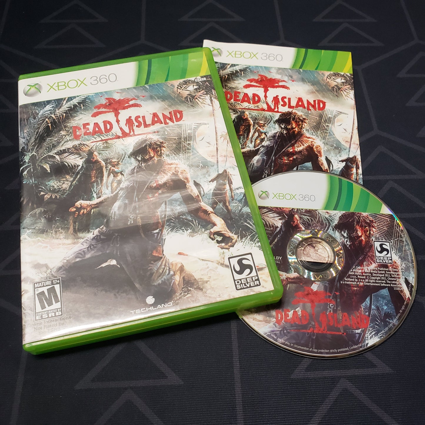 Image shows the case, manual and disc for the video game Dead Island for Xbox 360