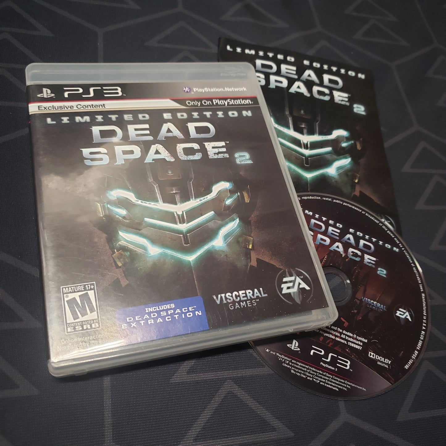 Image shows the case, manual and disc for the video game Dead Space 2 for Playstation 3