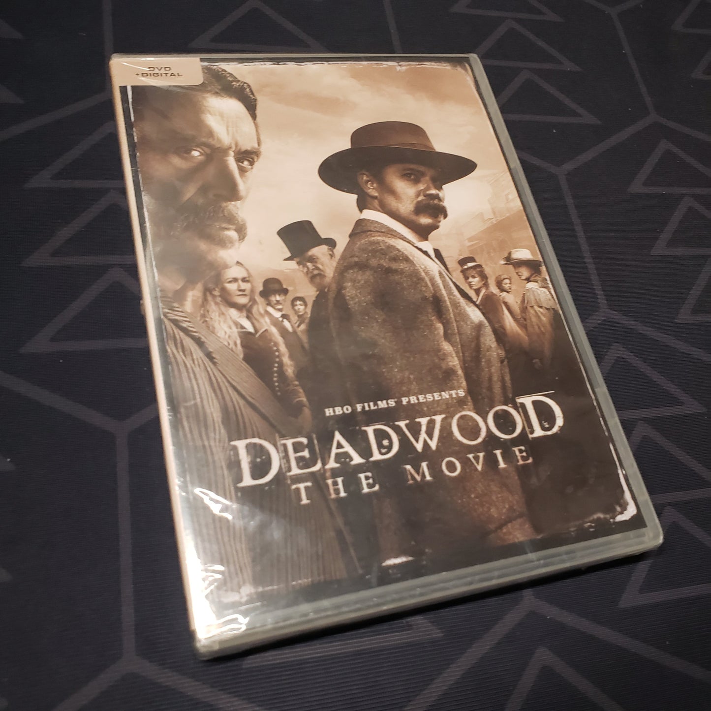 Image shows the front of the case for the movie Deadwood: The Movie on DVD