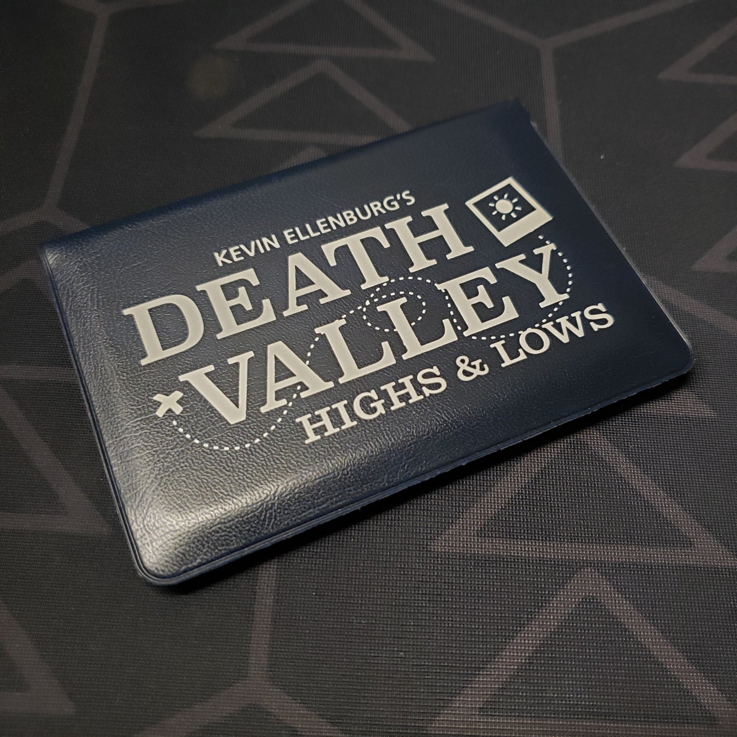 Image shows the front of the card wallet for the Death Valley: Highs & Lows card game