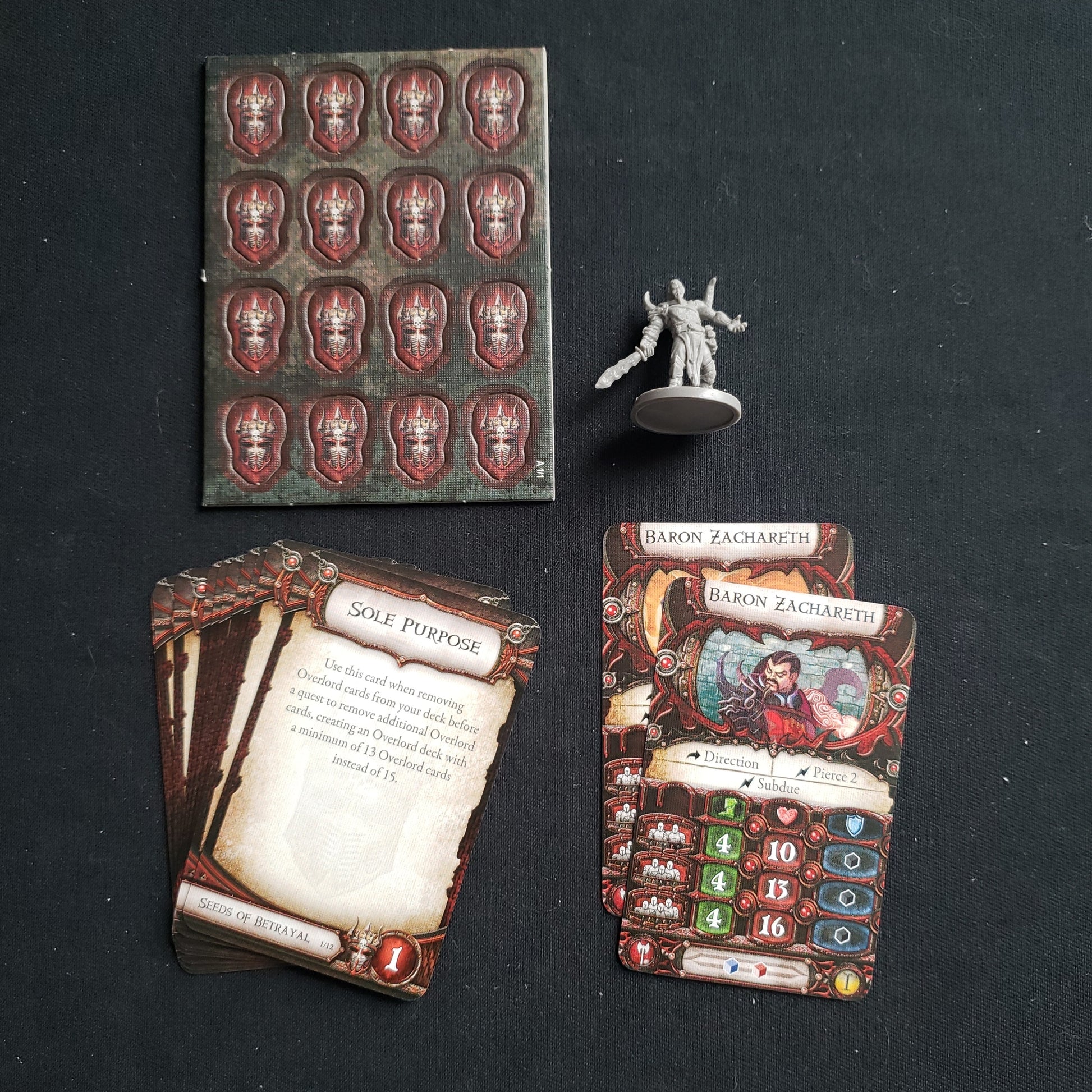 Image shows the components for the Baron Zachareth Lieutenant Pack expansion for the board game Descent: Journeys in the Dark Second Edition