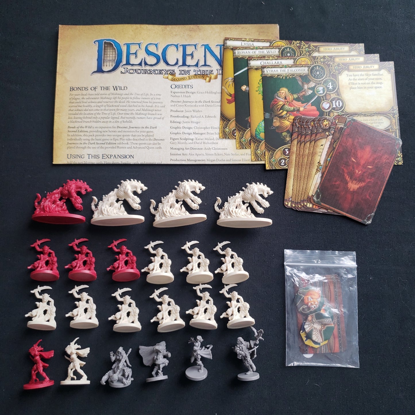 Image shows the components & instructions for the Bonds of the Wild expansion for the board game Descent: Journeys in the Dark Second Edition