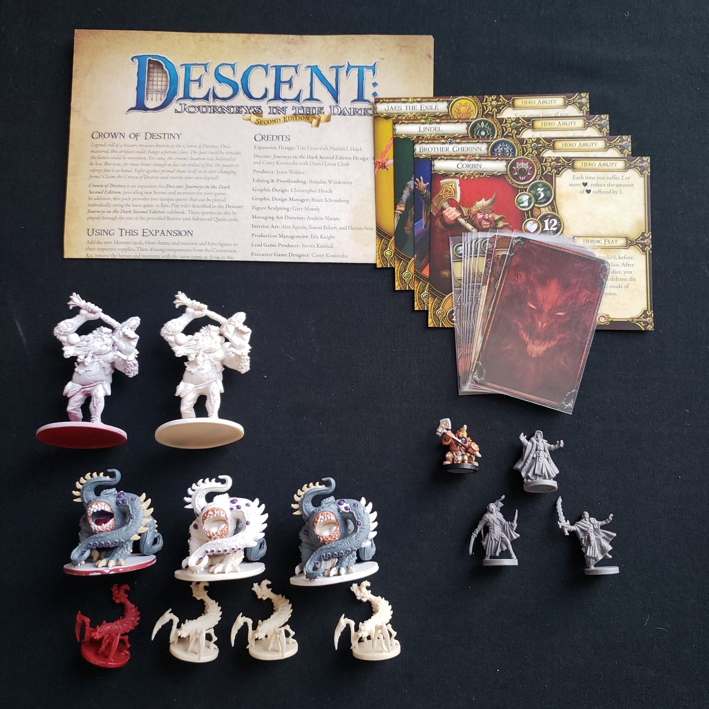 Image shows the components & instructions for the Crown Of Destiny expansion for the board game Descent: Journeys in the Dark Second Edition