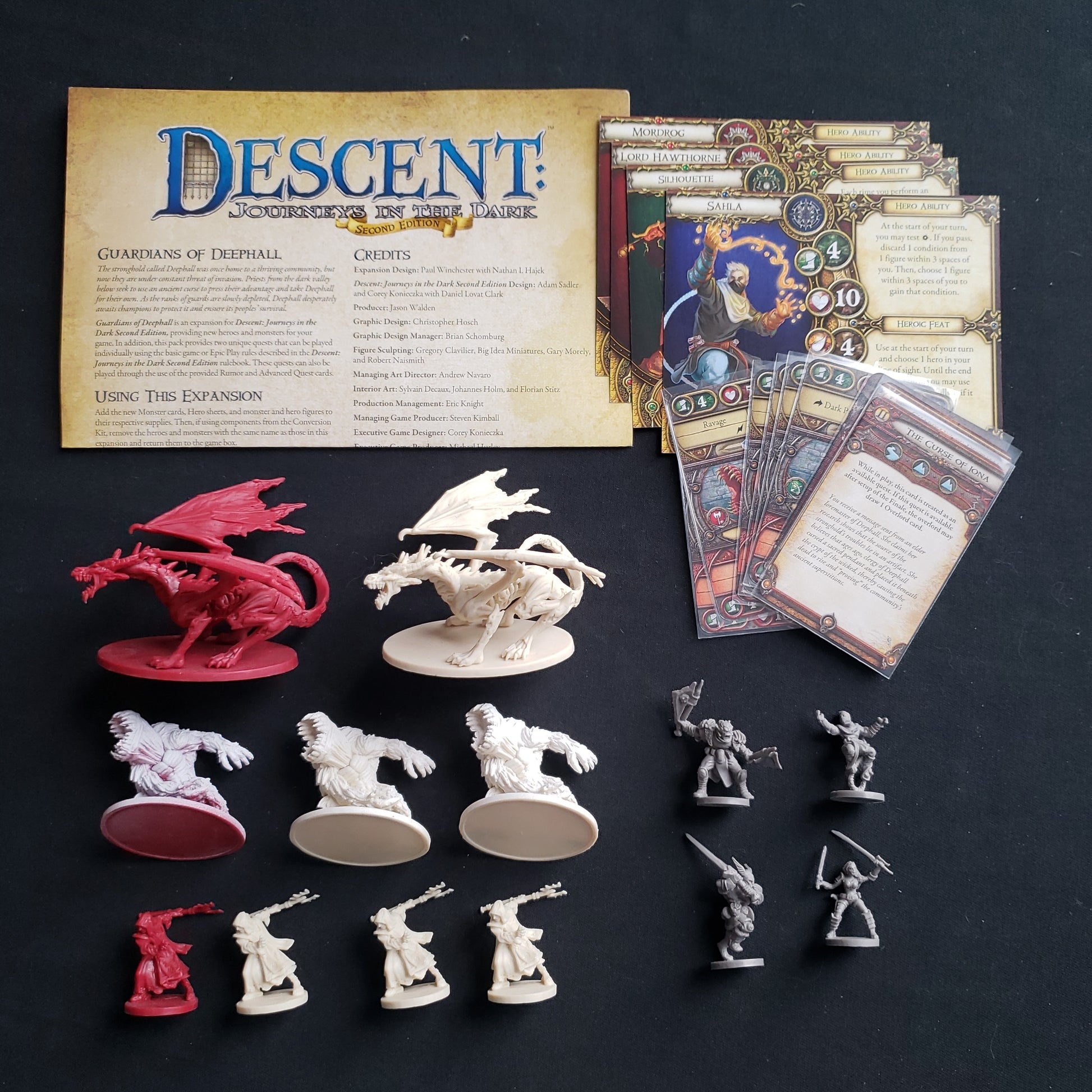 Image shows the components and instructions for the Guardians Of Deephall expansion for the board game Descent: Journeys in the Dark Second Edition