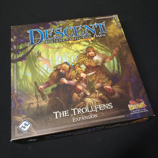Image shows the front cover of the box of the Trollfens expansion for the board game Descent: Journeys in the Dark Second Edition