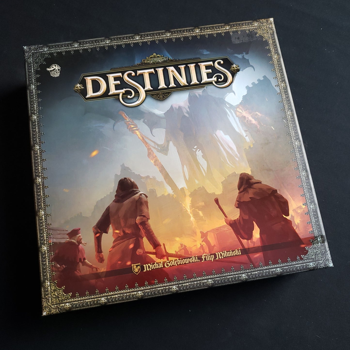 Image shows the front cover of the box of the Destinies board game