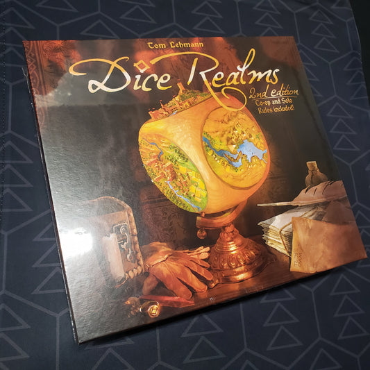 Image shows the front cover of the box for the Dice Realms board game