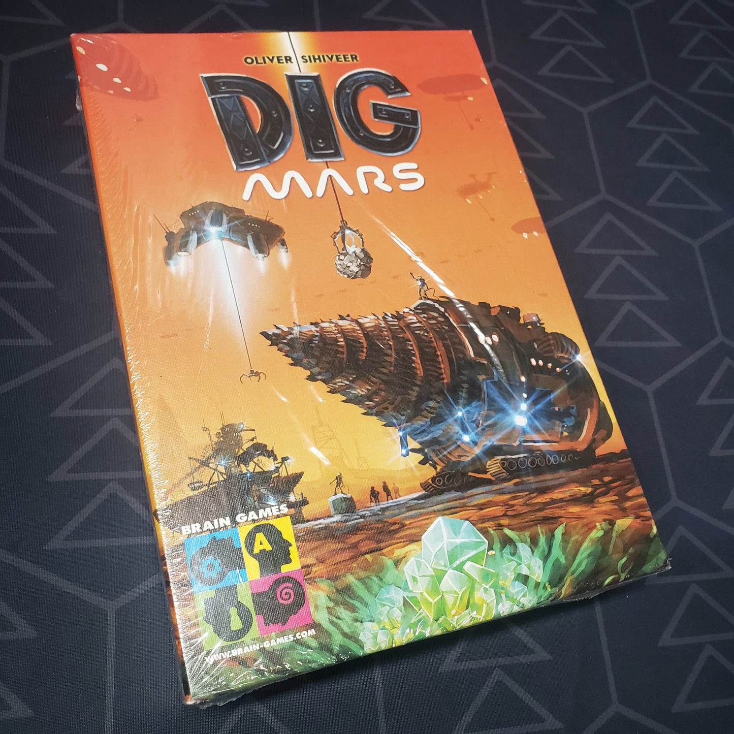 Image shows the front cover of the box for the Dig Mars board game