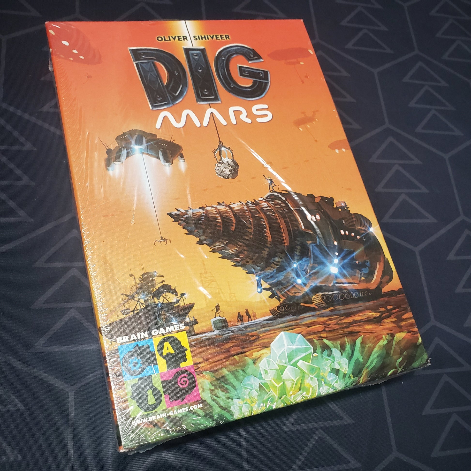 Image shows the front cover of the box for the Dig Mars board game