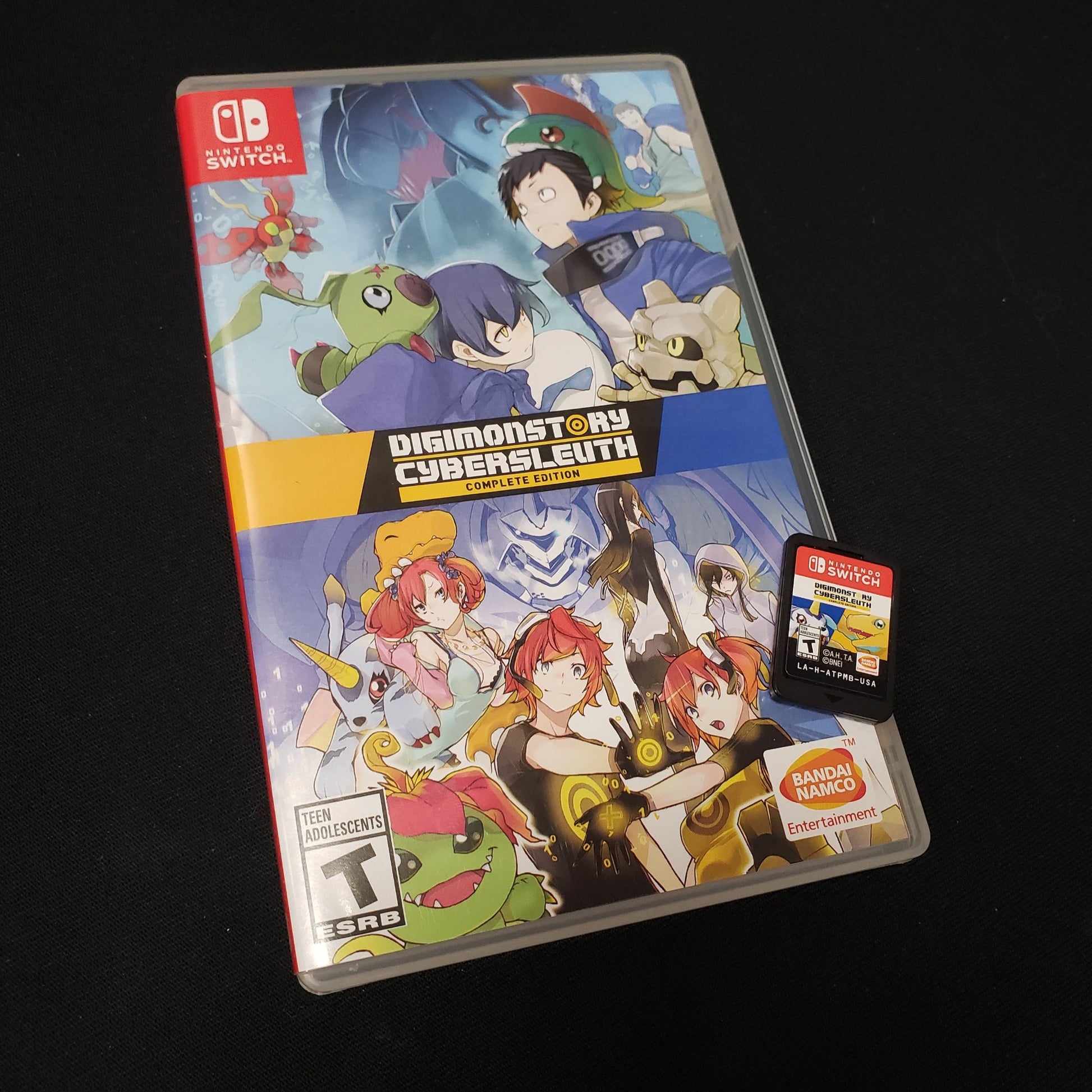 Image shows the case & cartridge for the video game Digimon Story Cyber Sleuth: Complete Edition for Nintendo Switch