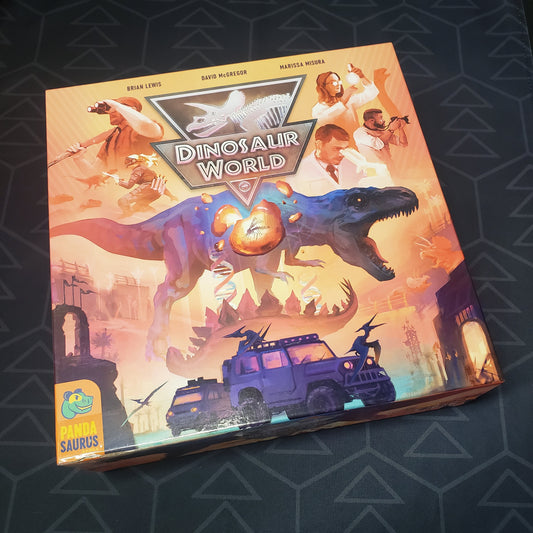 Image shows the front cover of the box of the Dinosaur World board game