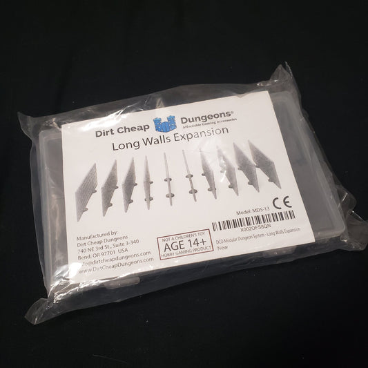 Image shows the front of the packaging of the Long Walls Expansion set for the Dirt Cheap Dungeons modular terrain system