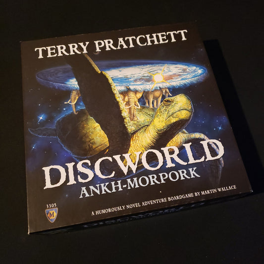Image shows the front cover of the box of the Discworld: Ankh-Morpork board game