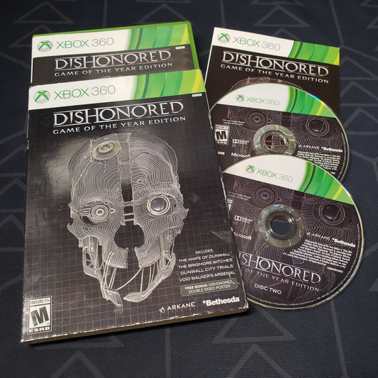 Image shows the case, sleeve, manual and two discs for the video game Dishonored: Game of the Year Edition for Xbox 360