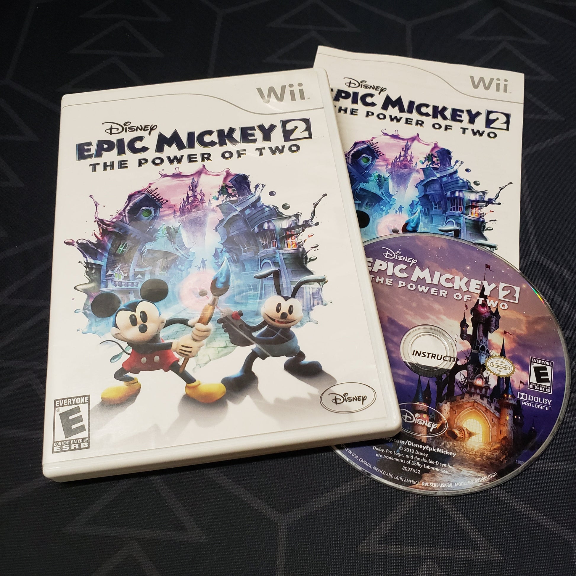 Image shows the case, manual and disc for the video game Disney Epic Mickey 2: The Power of Two for Nintendo Wii