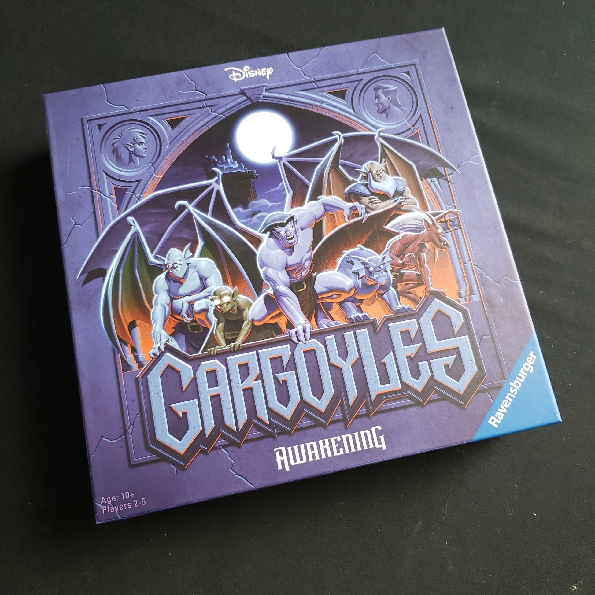 Image shows the front cover of the box of the Disney Gargoyles: Awakening board game