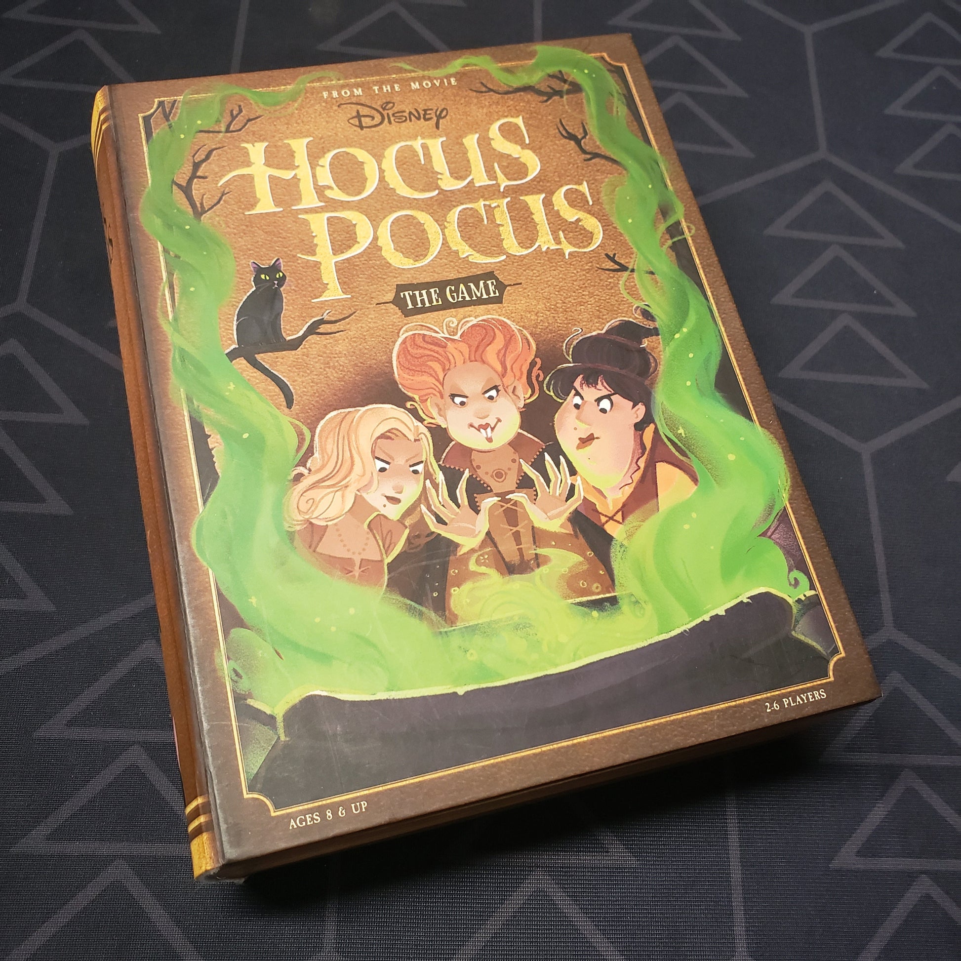 Image shows the front cover of the box for the board game Disney Hocus Pocus: The Game