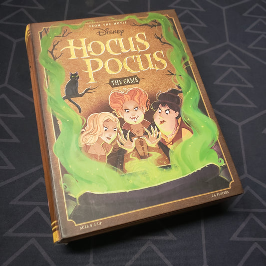 Image shows the front cover of the box for the board game Disney Hocus Pocus: The Game