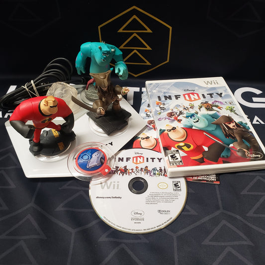 Image shows the case, manual, game disc and toys-to-life components for the video game Disney Infinity: Starter Pack 1.0 for Nintendo Wii