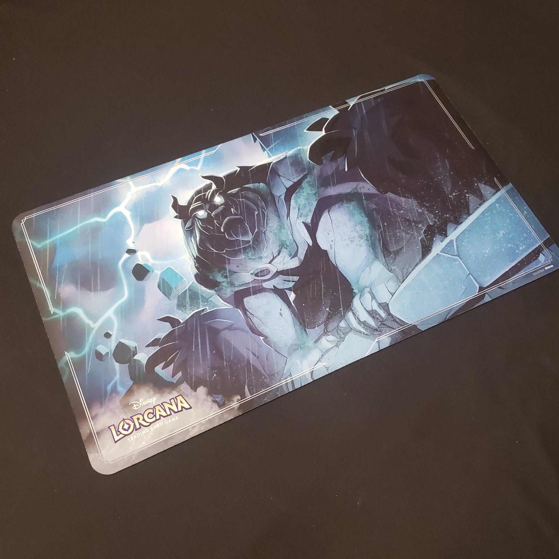 Image shows a playmat featuring Rise of the Floodborn: Beast Gargoyle art for the Disney Lorcana card game