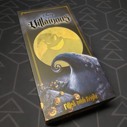 Image shows the front cover of the box of the Filled With Fright expansion for the card game Disney Villainous